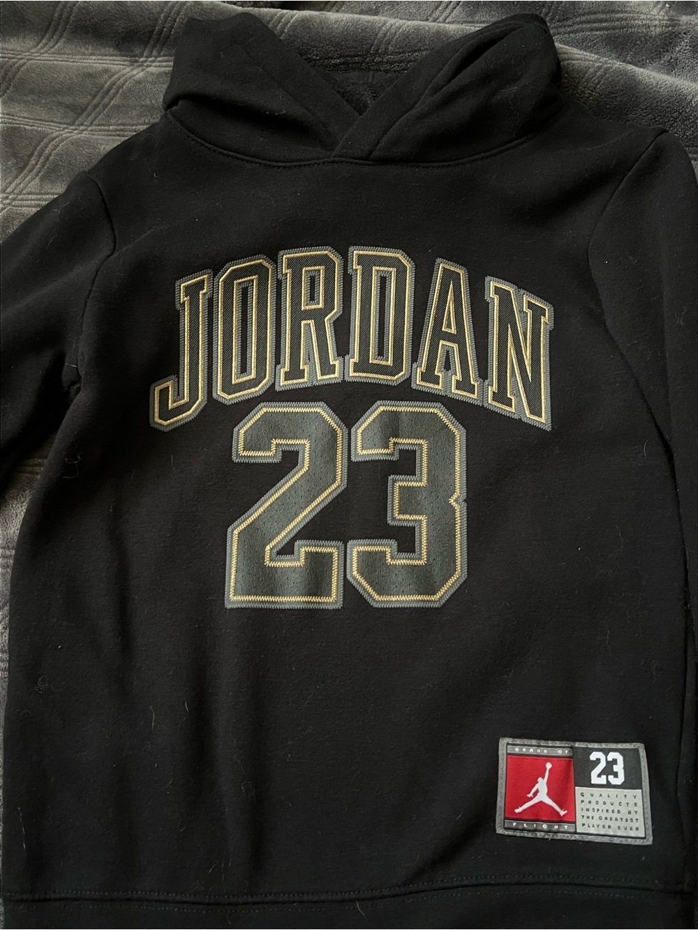 Jordan Black Hoodie with Gold-Trim '23' Graphic